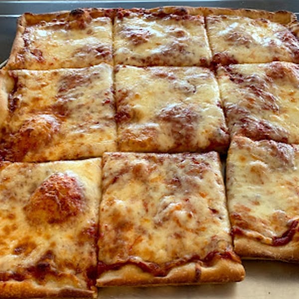 Valentino's Pizzeria's square-cut cheese pizza, with a thick crust and melted golden cheese.